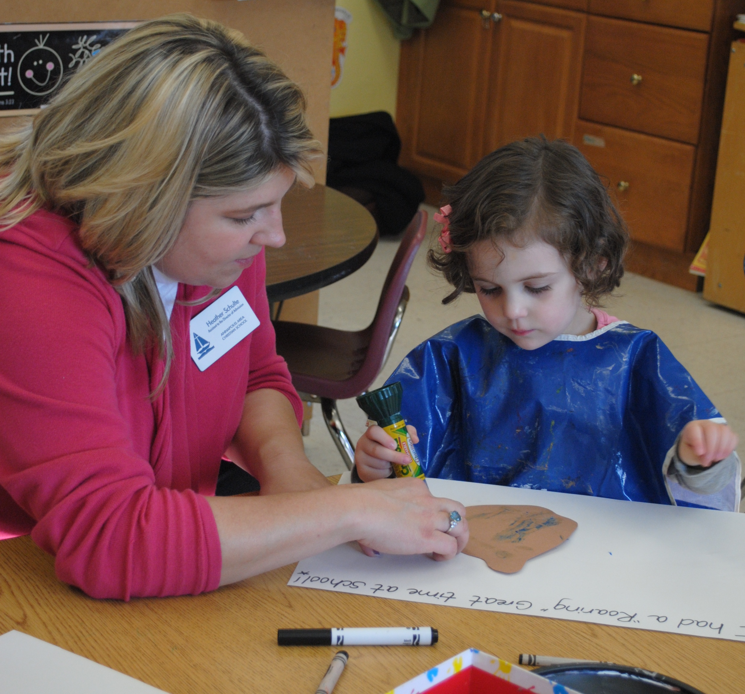 Experiencing a mock school day, Heather Schulte, Assistant to the Director of Admission, works with one of the participants Experiencing a mock school day, Heather Schulte, Assistant to the Director of Admission, works with one of the participants