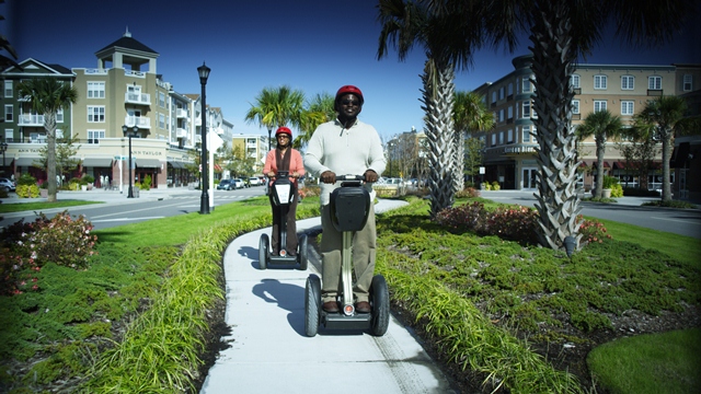Couple riding segways at the Market Common in Myrtle Beach. Couple riding segways at the Market Common in Myrtle Beach.