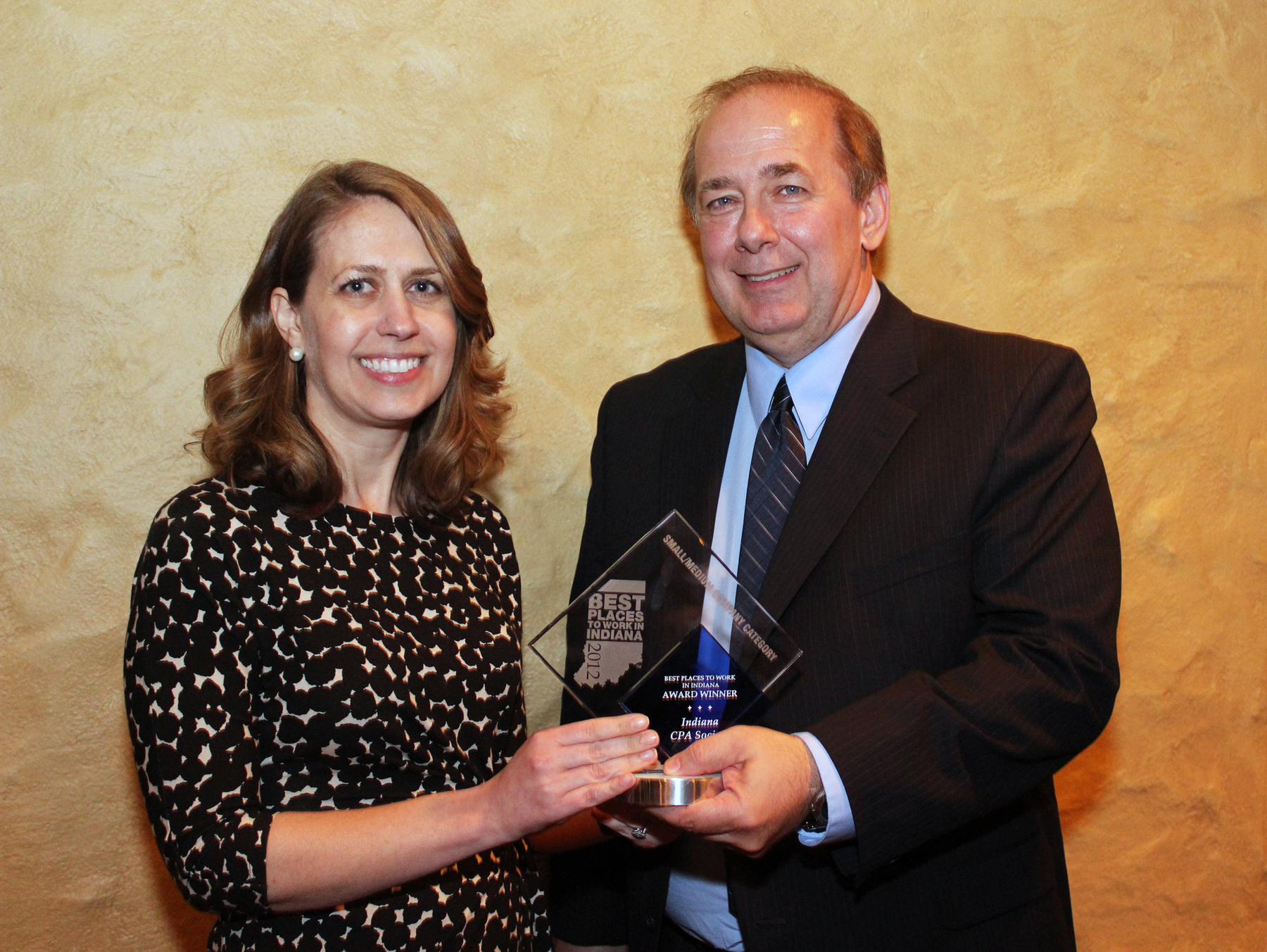 INCPAS Vice President - Member Services Jennifer Briggs, CAE, and INCPAS Vice President - Finance Mike Barker, CPA, accepted the Best Places to Work award of excellence on behalf of the Indiana CPA Society. INCPAS Vice President - Member Services Jennifer Briggs, CAE, and INCPAS Vice President - Finance Mike Barker, CPA, accepted the Best Places to Work award of excellence on behalf of the Indiana CPA Society.