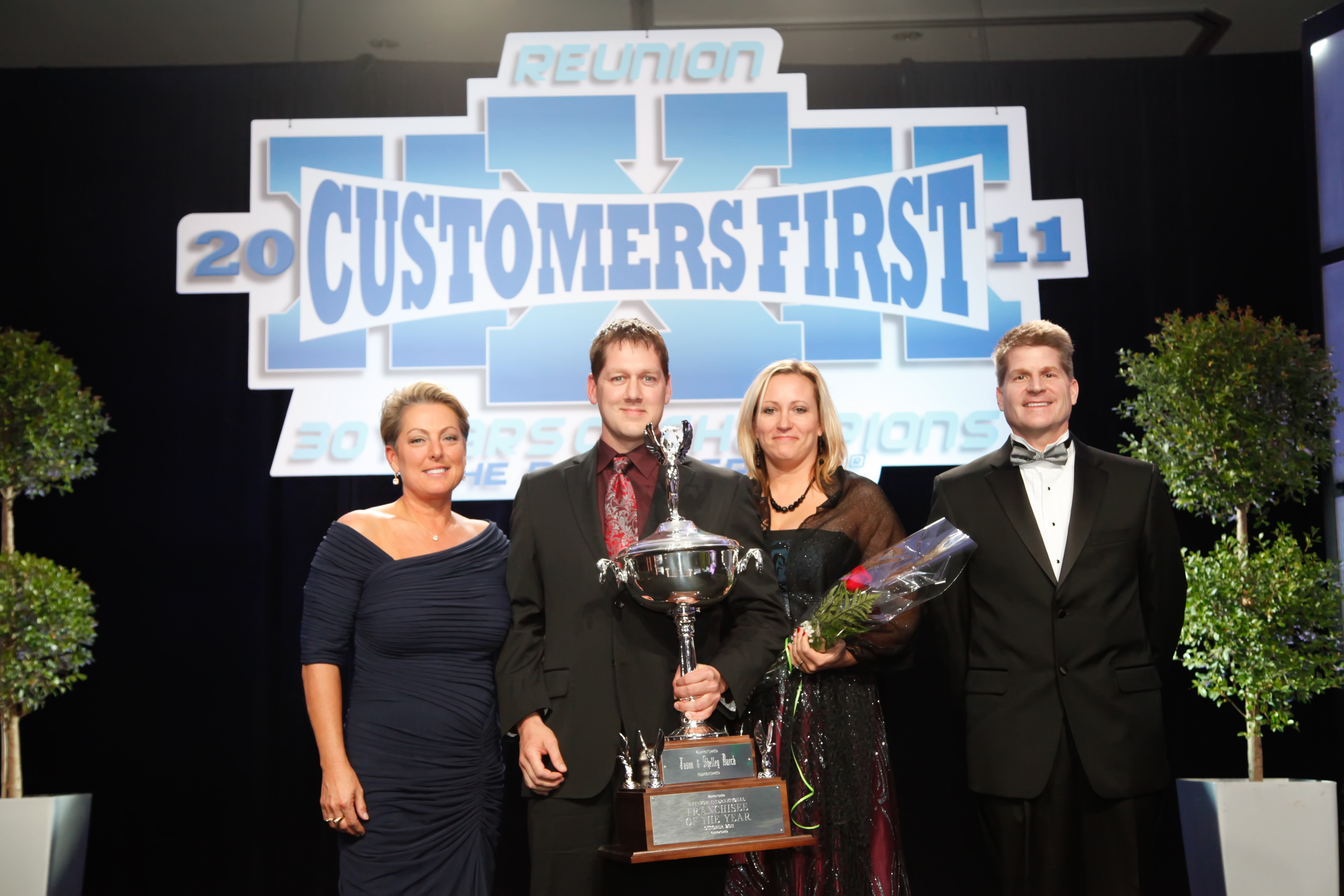Left to Right: Dina Dwyer-Owens, CEO of The Dwyer Group; Jason & Shelley Barck, Franchisees of the Year Rainbow International of Des Moines; Rob White, President of Rainbow International Left to Right: Dina Dwyer-Owens, CEO of The Dwyer Group; Jason & Shelley Barck, Franchisees of the Year Rainbow International of Des Moines; Rob White, President of Rainbow International