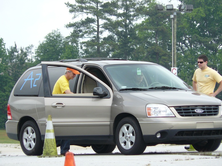 David Barton of UHY Advisors prepares for another run on the test track with a student. As a volunteer instructor with Tire Rack Street Survival School, Barton helps prepare teens for real-world driving emergencies. David Barton of UHY Advisors prepares for another run on the test track with a student. As a volunteer instructor with Tire Rack Street Survival School, Barton helps prepare teens for real-world driving emergencies.