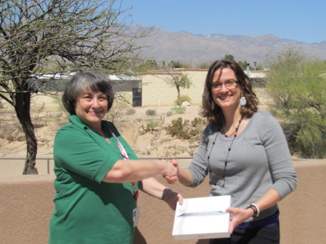 Access's Brandy Taylor presents iPad to Rita Cartwright Access's Brandy Taylor presents iPad to Rita Cartwright